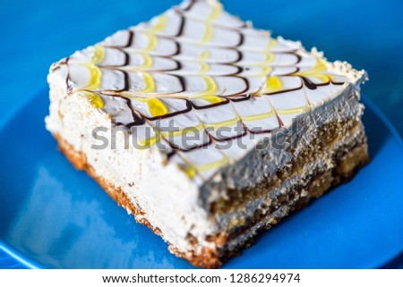 Sponge cake on a wooden background photographed close-up.