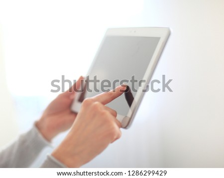 close up.woman's hand pressing on screen digital tablet .photo w