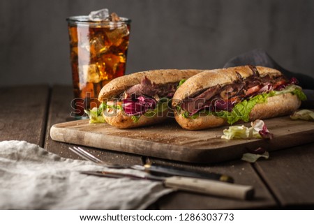 Tasty sandwich with roast beef Royalty-Free Stock Photo #1286303773