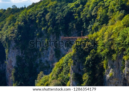 Zeda-gordi, Georgia: Tourists On Observation Platform In The End Of Narrow Suspension Bridge Or Pendant Road Up To 140 Meters Above Precipice On Territory Okatse Canyon, Dadiani park Kutaisi.