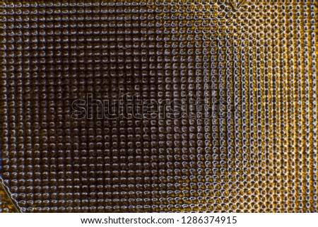 Texture of corrugated dark glass close