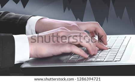 Closeup of businessman typing on laptop computer