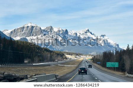 Driving on highway through Canadian Rocky Mountains near Canmore, Alberta