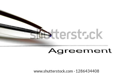 Close-up of a line for signing a contract on white paper with a pen - surface to place the signature to seal a contract in close-up