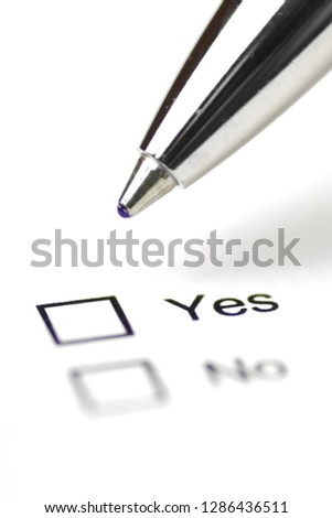 Close-up on a field to decide whether to approve or reject - Ballpoint pen makes a decision for or against
