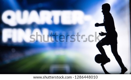 QUARTER-FINAL, QUARTERFINAL big Tittle and Silhouette of Soccer player. Football photo, Edit space