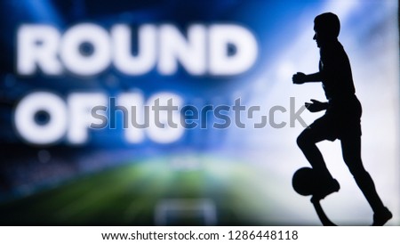 ROUND OF 16 Tittle and Silhouette of Soccer player. Football photo, Edit space