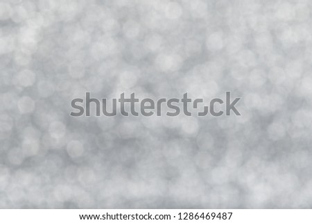 Defocused Natural Glitter Lights Bokeh. Abstract Pattern Silver Diamond Texture Background