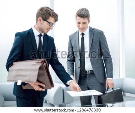 business colleagues standing in a modern office