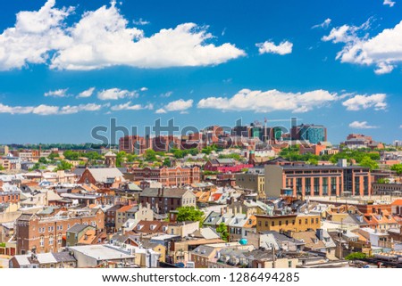 Baltimore, Maryland, USA cityscape overlooking little Italy and neighborhoods.