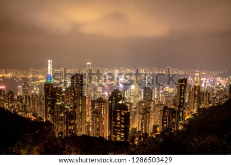Hong Kong, China. Beautiful architecture building exterior cityscape skyline with dark sky background from Victoria Peak. Night photo.