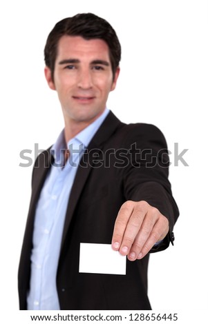 A businessman handing his card.