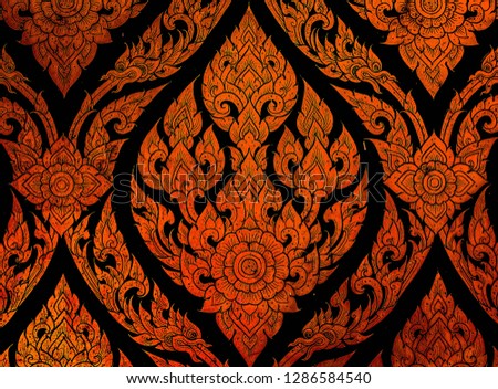 Closeup Thai pattern carving lotus picture at door in temple