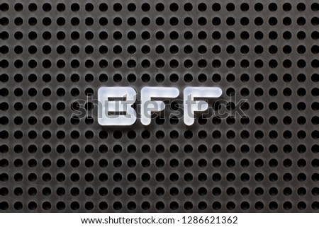 Black color pegboard with white letter in word BFF (Abbreviation of best friend forever)