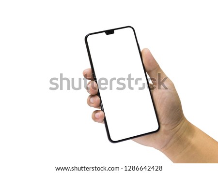 Man holding a black mobile phone with blank screen isolated on a white background.