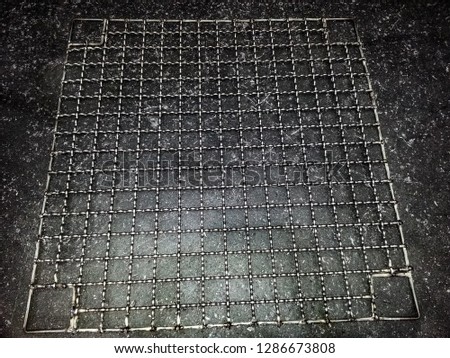 Stainless steel grating on the cement floor