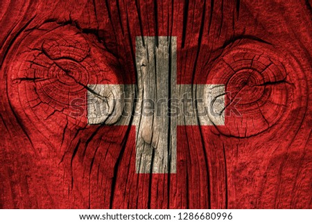Swiss flag on a wood texture for decoration or design