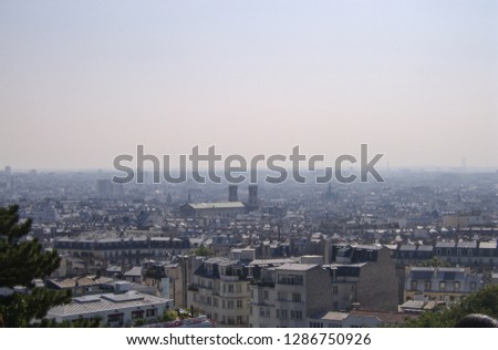 view of rooftops from buildings in a part of paris france skyline
