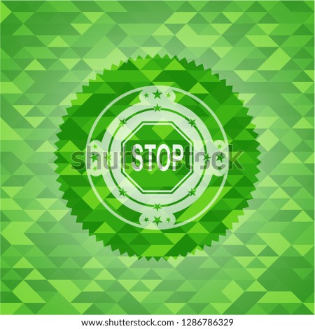 stop icon inside green mosaic emblem