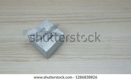 gray gift box on wood background