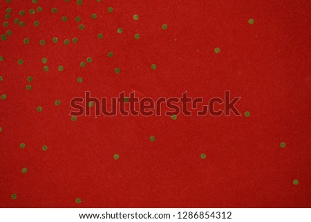 gold dots on red paper
