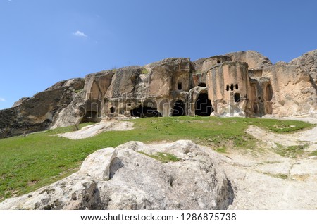 Historical ancient Frig (Phrygia, Gordion)  Valley, structures carved into rocks and Ayazini Church. Frig Valley is popular tourist attraction in the Ayazini, Afyon. / Turkey. Royalty-Free Stock Photo #1286875738