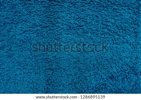 Close-up of blue artificial fabric texture, background
