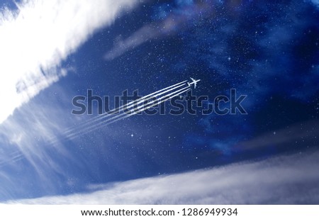 Jet plane and contrail in the magic starry sky