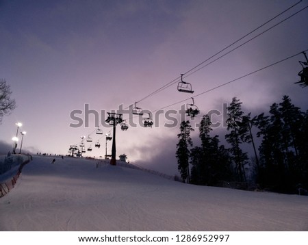 very beautiful sunset in mountains.ski lift motion