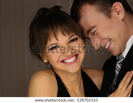 Happy elegant couple in classic dress
