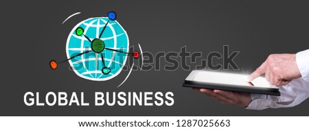 Finger pointing on digital tablet with global business concept on background