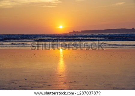 Beautiful sunset landscape at the beach of Essaouira at the sunset. Essaouira is located at the coast of Atlantic Ocean of Western Morocco.      
