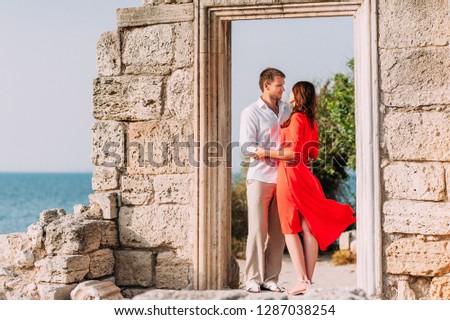 Couple hugging, newlyweds on honeymoon, relations happiness. Man and woman hugging. Passionate kiss of a man and a woman. Lovers. Relationship between a man and a woman. Honeymoon newlyweds. In love