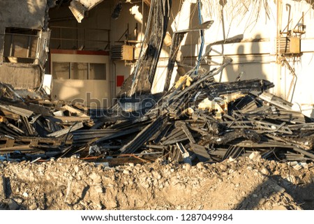 Pile of twisted and broken metal demolition site