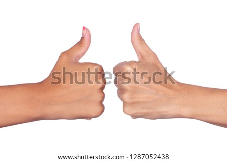 Female hands making signals with the thumb up