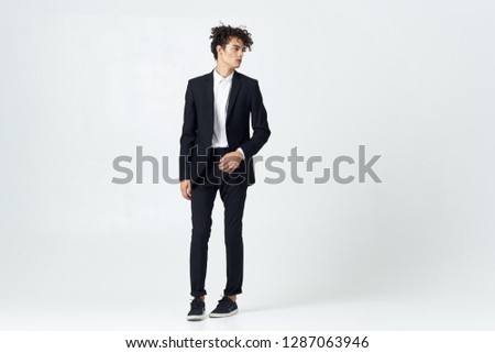 Cute elegant man in a dark suit office worker