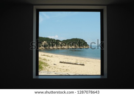 sea beach scene behind the square window frame