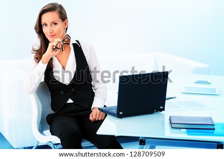 Modern business woman is working at the office.