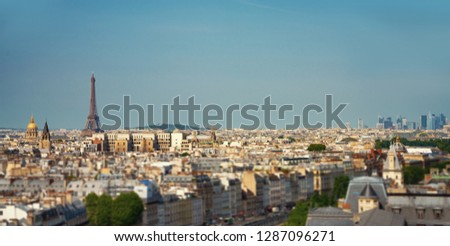 small paris street with view on the famous paris eiffel tower on a sunny day with some sunshine Royalty-Free Stock Photo #1287096271