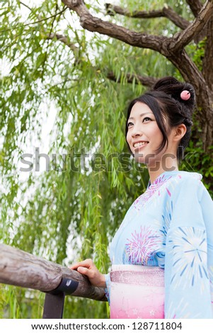 japanese kimono woman relaxing in park