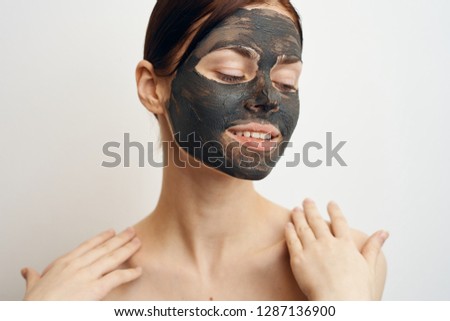 woman with eyes closed smiles on face
