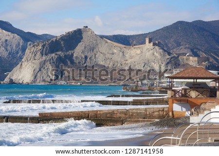 View of the Genoese fortress from the Bay of Sudak, Crimea. Sunny winter day. Royalty-Free Stock Photo #1287141958