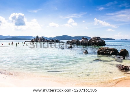 Beautiful beach scenery under blue sky and white clouds in summer in Thailand