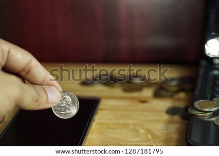 Coin stacks on table. Office desk with money coins and business financial planning. Saving money concept - Image Royalty-Free Stock Photo #1287181795