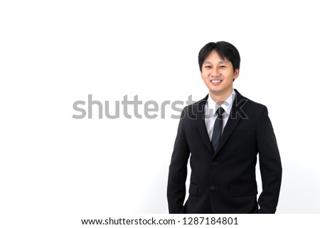 Portrait of young Asian businessman on white background