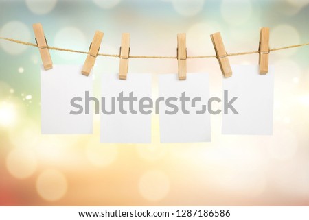 Collection of various notes and a clothes pegs on white background with clipping path