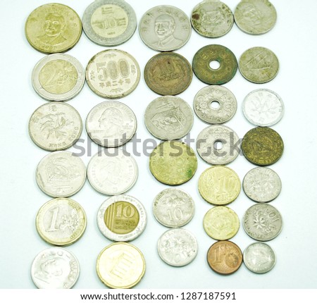 Including coins of each country, high-angle white backdrop