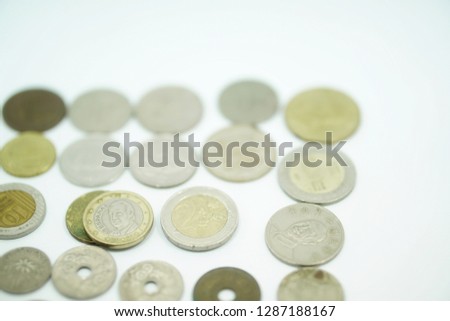 Including coins of each country, high-angle white backdrop