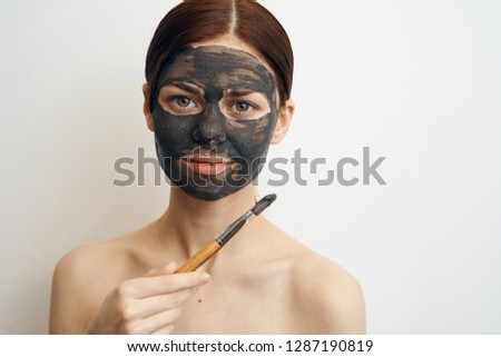 woman with a cosmetic mask