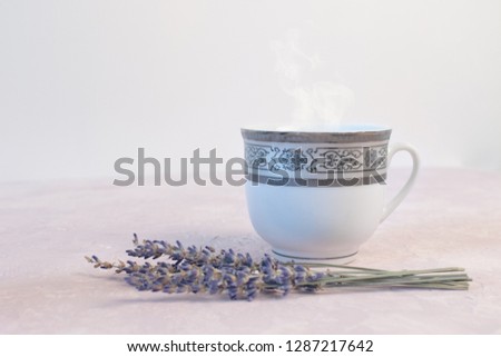 Coffee and lavender flower on pink table from above. Woman working desk. Cozy breakfast. Mockup.